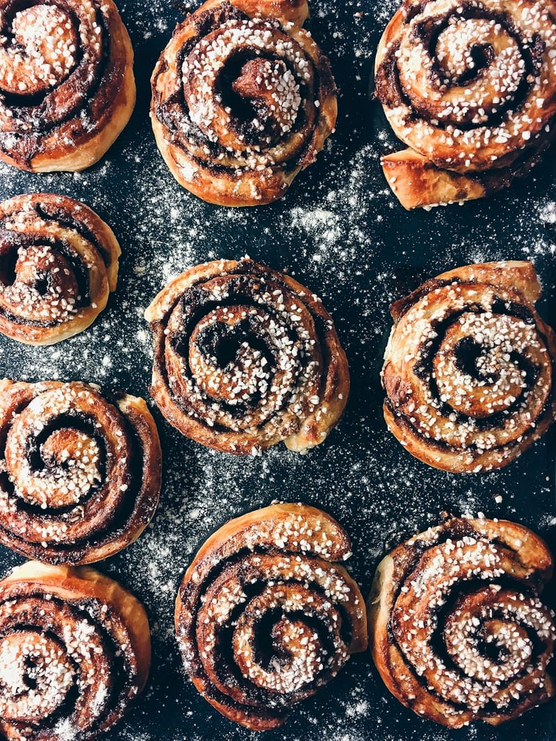 Soft pillowy cinnamon rolls with cream cheese frosting drizzle