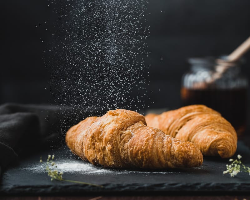 Assortment of freshly baked pastries including croissants and danishes